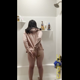 Emi smiles for the camera, then stands in the shower in a pink hoodie and jiggles her poop out, smearing it all over her bare ass. Vertical format video. Over 6 minutes.